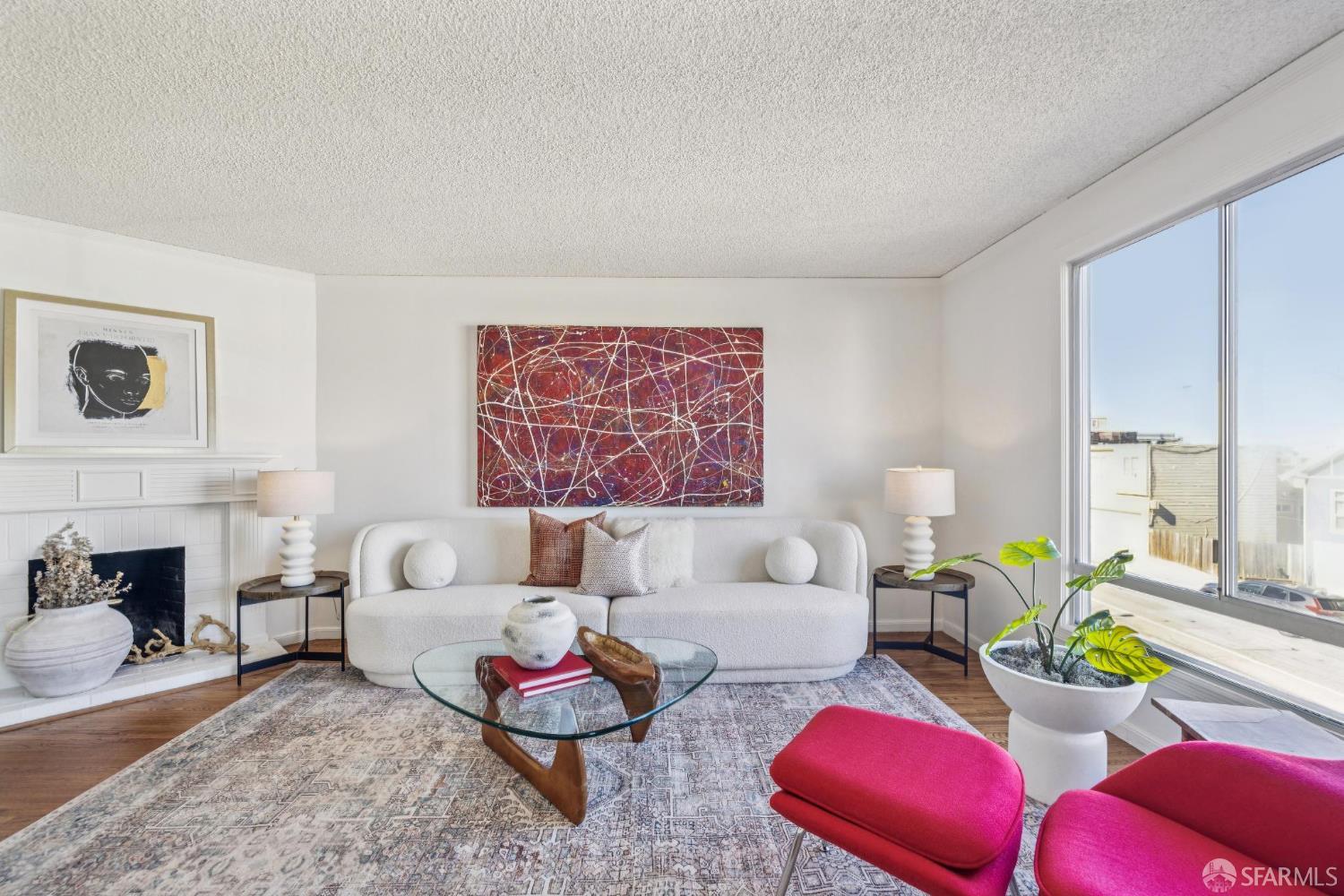 2015-2017 Judah Street San Francisco, CA 94122 - Photo 34 of 58 a living room with furniture and a fireplace