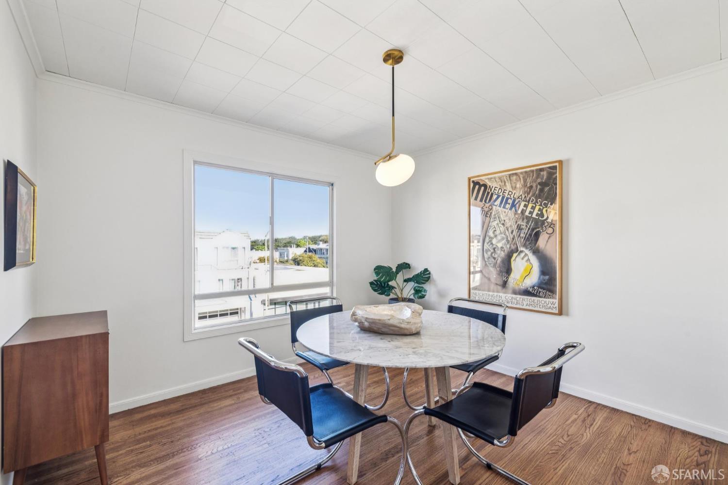 2015-2017 Judah Street San Francisco, CA 94122 - Photo 36 of 58 a view of a dining room with furniture window and wooden floor