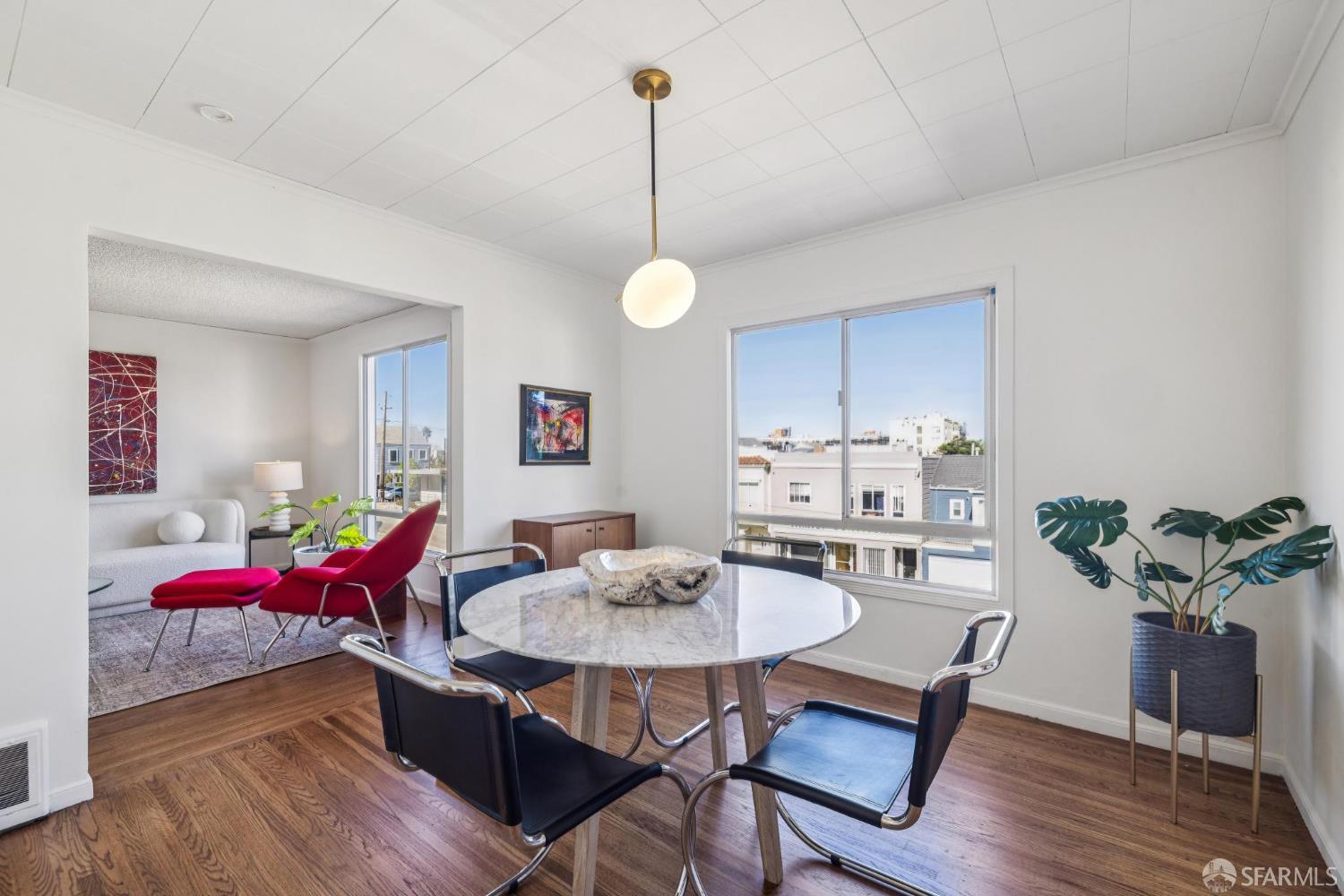 2015-2017 Judah Street San Francisco, CA 94122 - Photo 37 of 58 a view of a dining room with furniture window and wooden floor