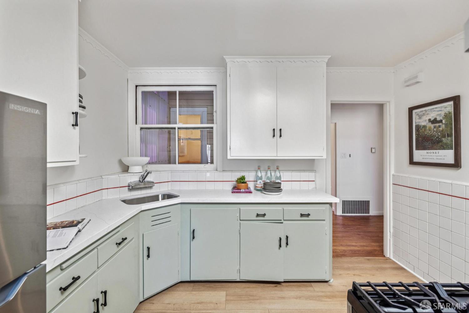 2015-2017 Judah Street San Francisco, CA 94122 - Photo 40 of 58 a kitchen with a sink window and cabinets