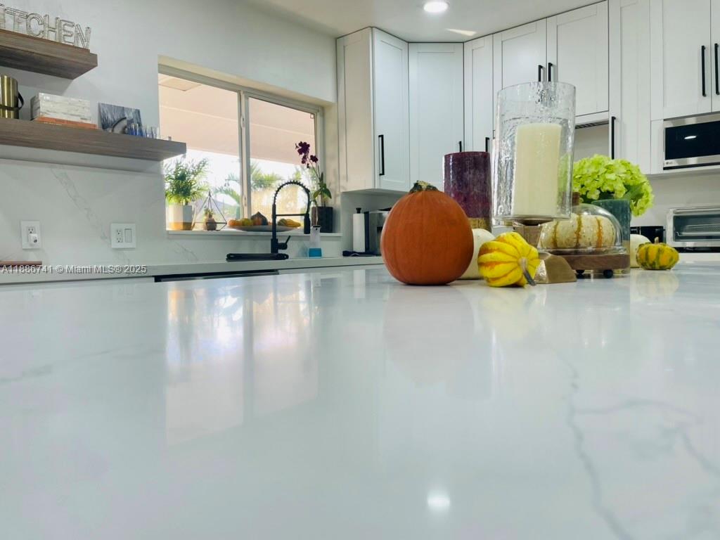 8410 Southwest 201st Street Cutler Bay, FL 33189 - Photo 12 of 33 a room with window and a table