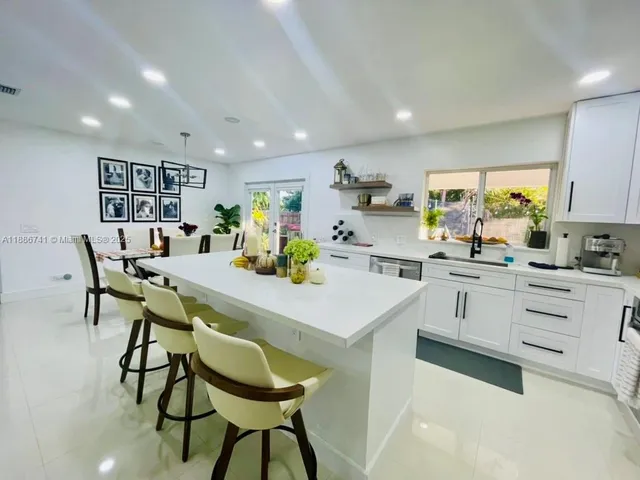 a bedroom with a bed and flat screen tv