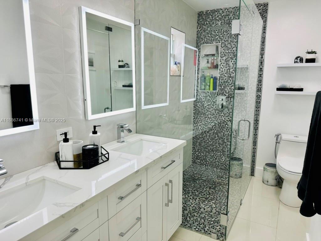 8410 Southwest 201st Street Cutler Bay, FL 33189 - Photo 20 of 33 a bathroom with a sink and a shower