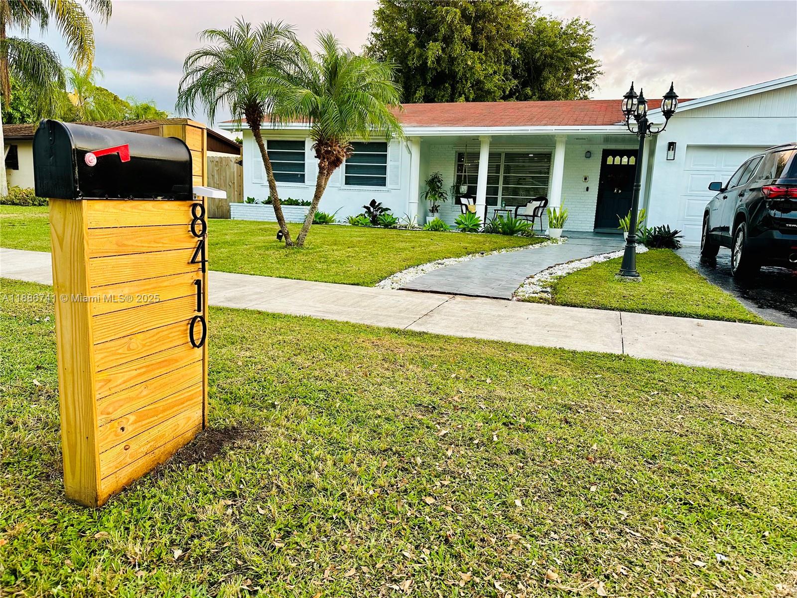 8410 Southwest 201st Street Cutler Bay, FL 33189 - Photo 3 of 33 a view of a house with backyard and sitting area