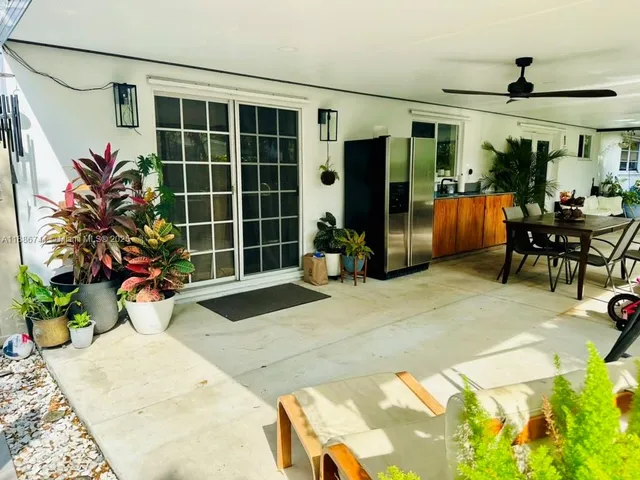a view of a chairs and table in patio