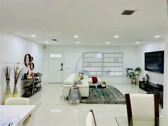 a room with furniture and a flat screen tv