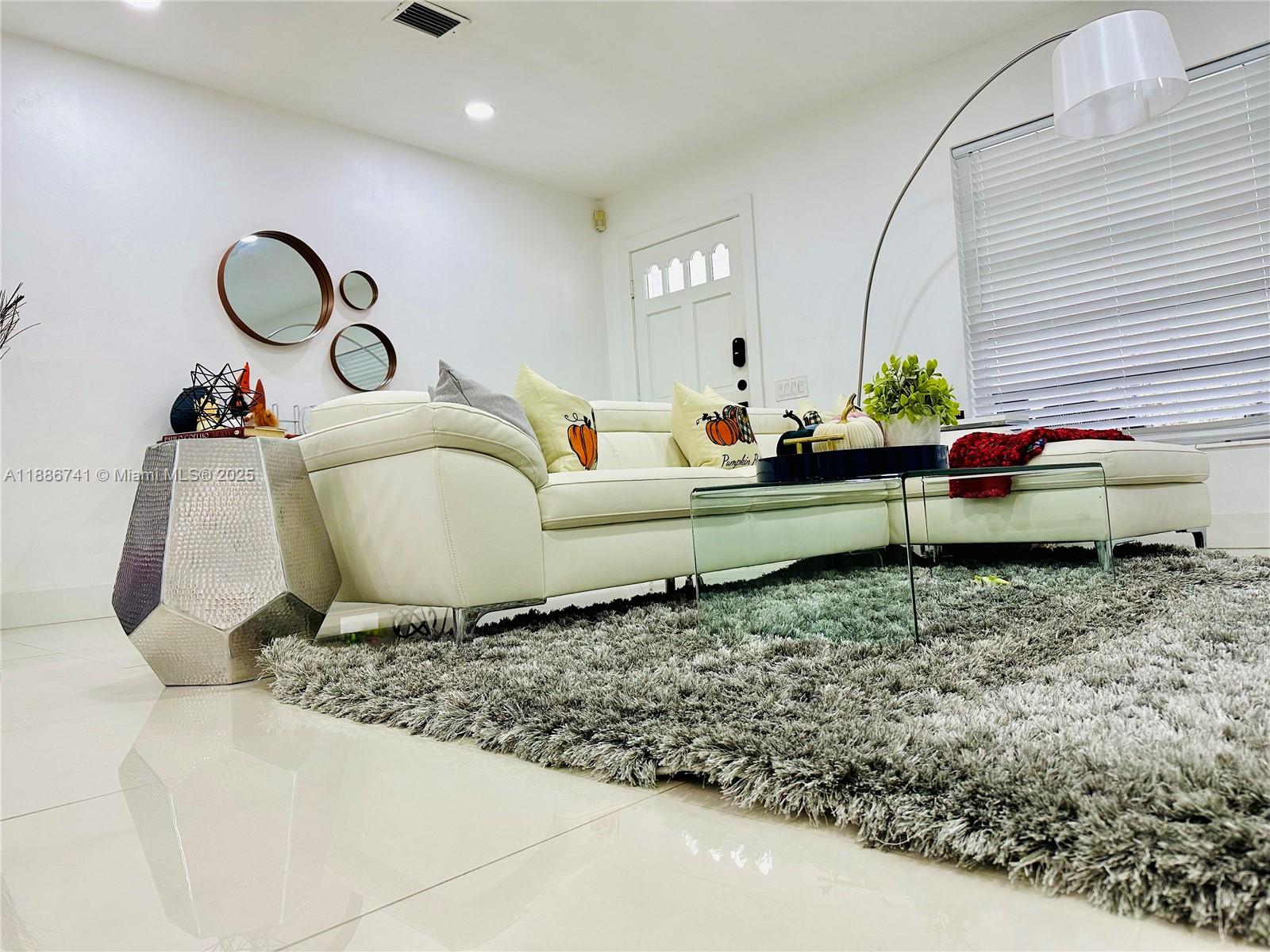 8410 Southwest 201st Street Cutler Bay, FL 33189 - Photo 9 of 33 a living room with a couch