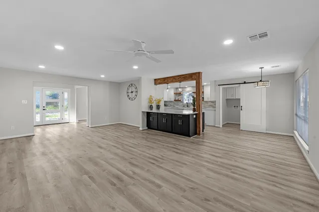 a view of a kitchen with a sink and a refrigerator