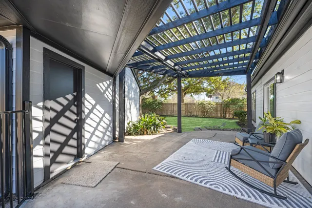 a patio with yard table and chairs