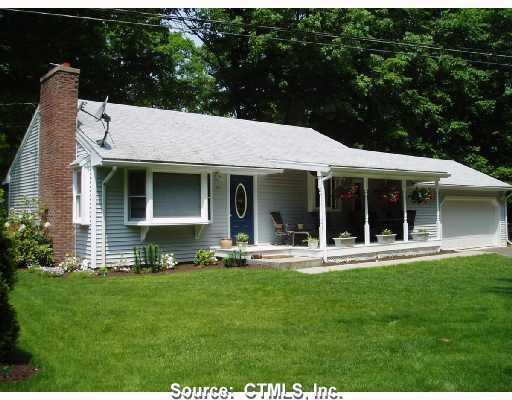 39 Juggernaut Road Prospect, CT 06712 - Photo 1 of 1 a front view of a house with a yard and porch
