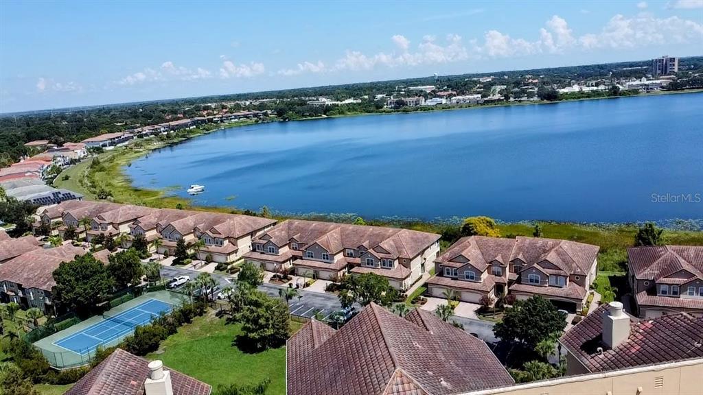 an aerial view of a houses with ocean view