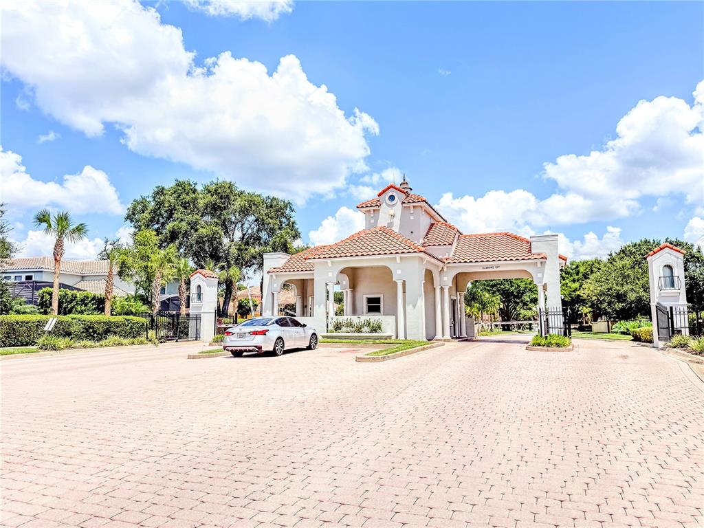 8755 The Esplanade, Unit 130 Orlando, FL 32836 - Photo 3 of 71 a view of a street with a building in the background