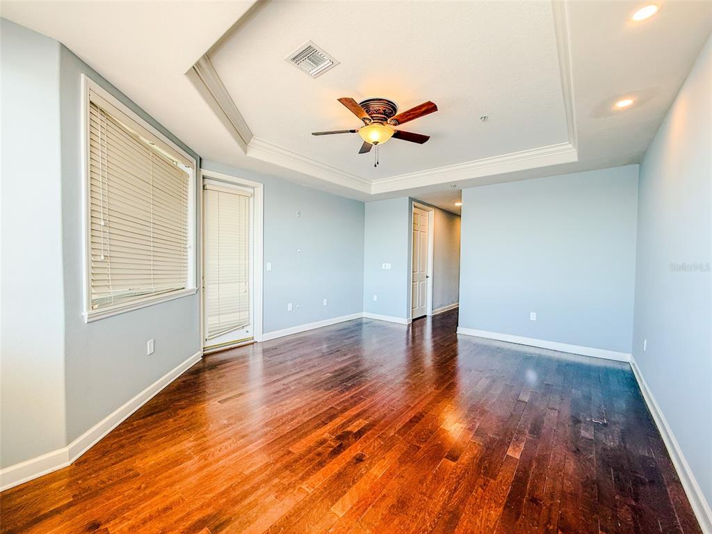 8755 The Esplanade, Unit 130 Orlando, FL 32836 - Photo 46 of 71 a view of an empty room with wooden floor and a window