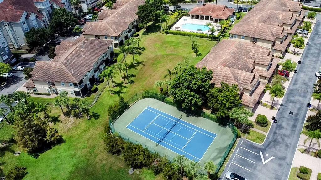 8755 The Esplanade, Unit 130 Orlando, FL 32836 - Photo 5 of 71 an aerial view of a house with a garden