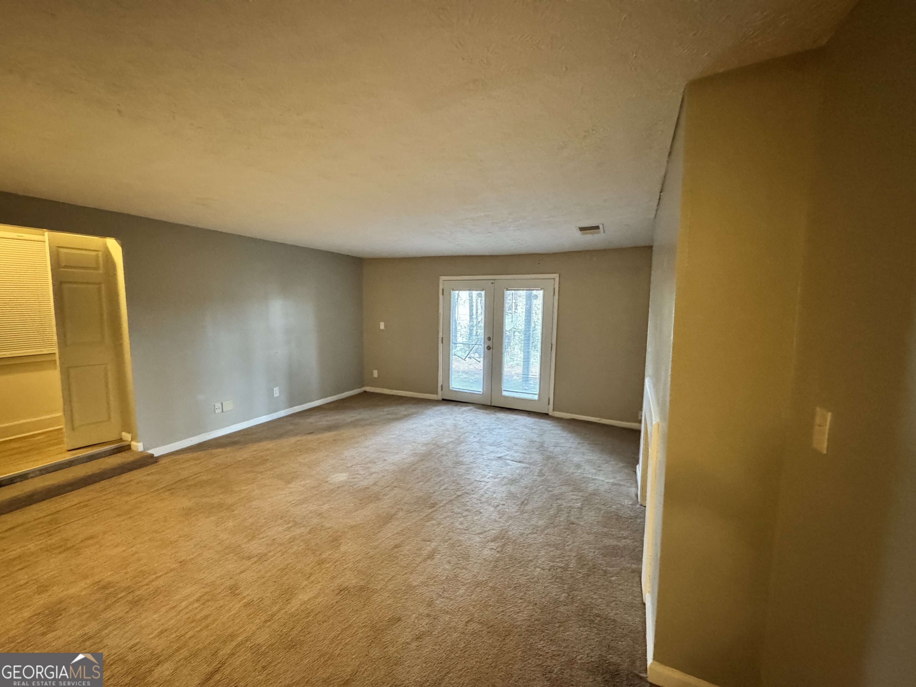 3575 Oakvale Road, Unit 911 Decatur, GA 30034 - Photo 4 of 10 a view of an empty room with a window