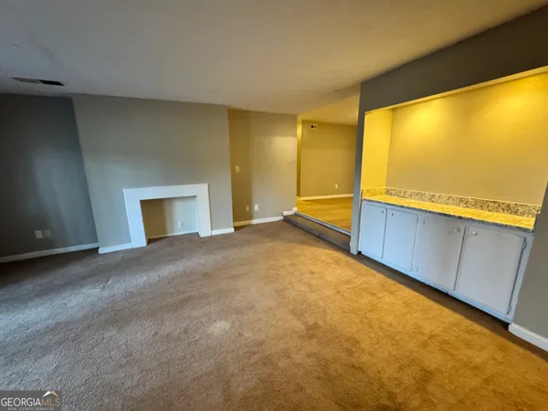 a view of an empty room with a window