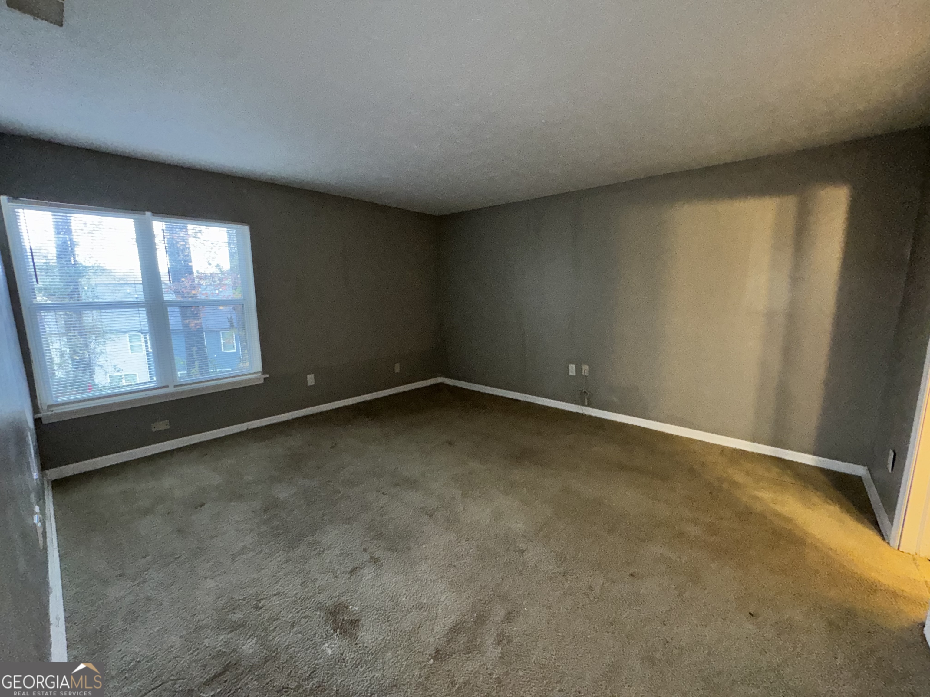 3575 Oakvale Road, Unit 911 Decatur, GA 30034 - Photo 9 of 10 an empty room with a window
