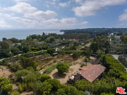 an aerial view of residential house with outdoor space
