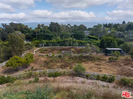 a view of a street with a yard