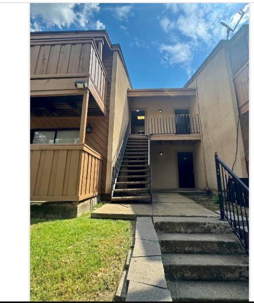 8110 Skillman Street, Unit 2057 Dallas, TX 75231 - Photo 1 of 16 View of property featuring stairs