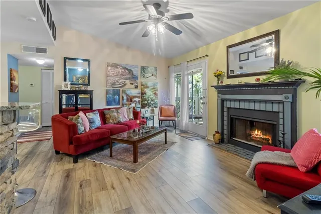 a living room with furniture and a fireplace