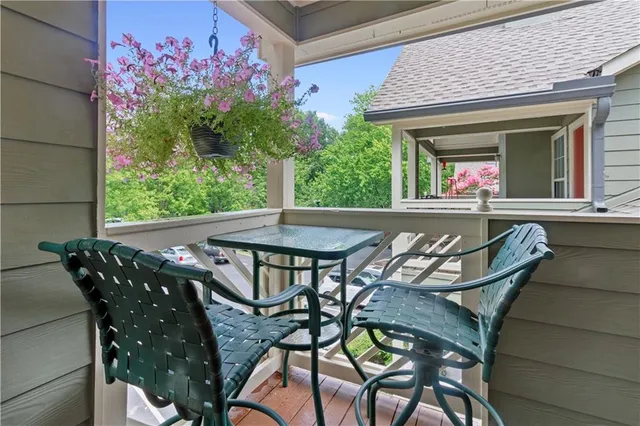 a view of a patio with table and chairs and potted plants