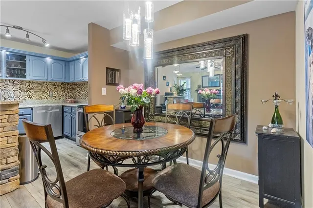 a dining room with furniture a livingroom and chandelier