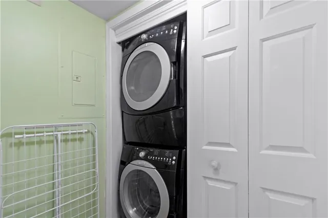 a close view of a utility room with dryer and washer