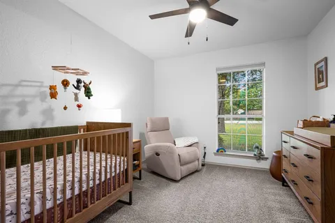 a bedroom with furniture and windows
