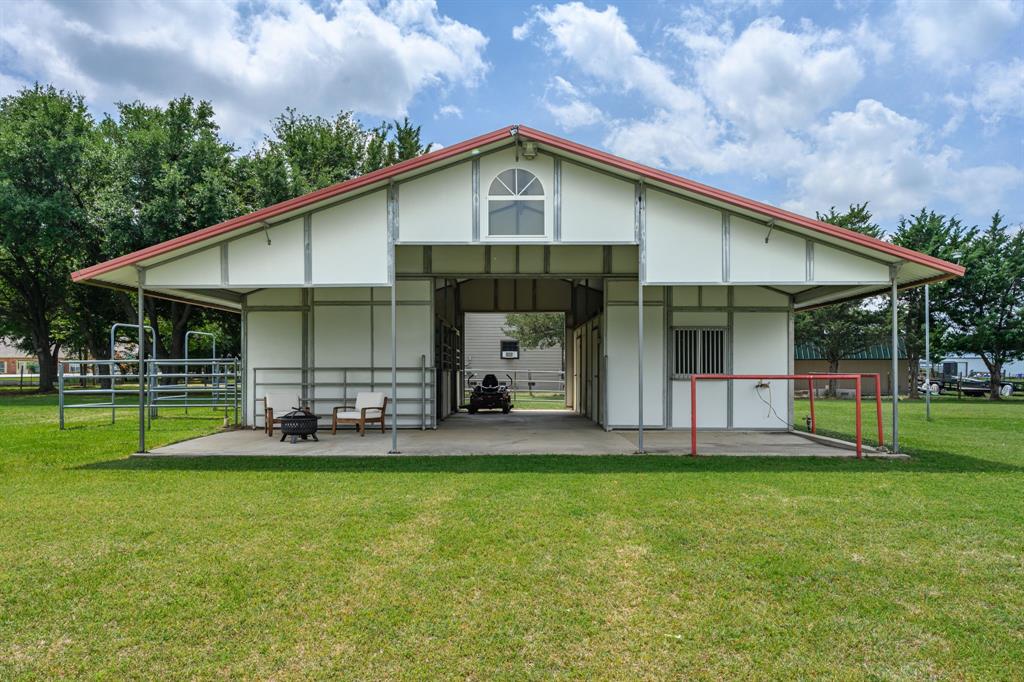 9624 Wells Road Wylie, TX 75098 - Photo 20 of 25 a front view of a house with a yard and trees