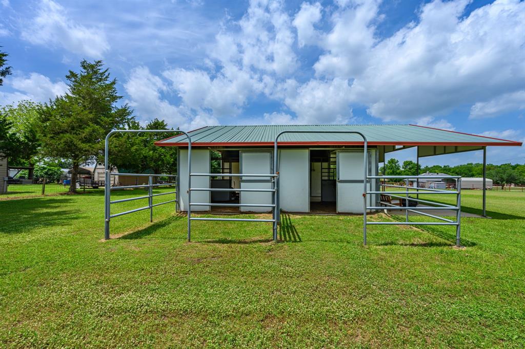 9624 Wells Road Wylie, TX 75098 - Photo 21 of 25 a view of a house with a yard and sitting area