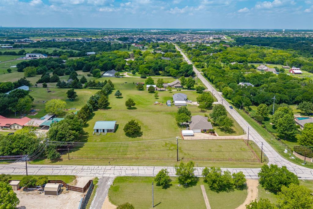 9624 Wells Road Wylie, TX 75098 - Photo 23 of 25 an aerial view of a house with a yard and lake view