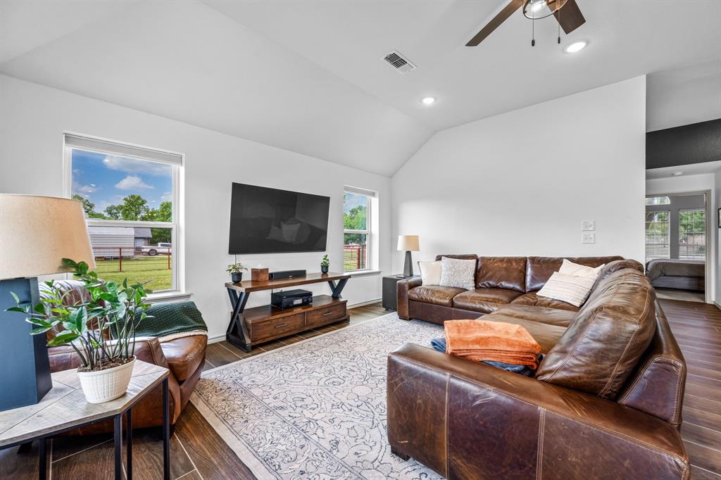 9624 Wells Road Wylie, TX 75098 - Photo 7 of 25 a living room with furniture and a flat screen tv