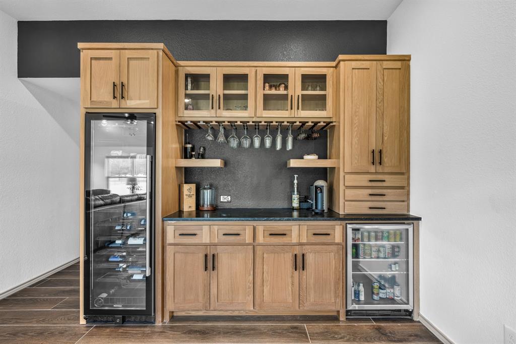 9624 Wells Road Wylie, TX 75098 - Photo 8 of 25 a kitchen with stainless steel appliances granite countertop a refrigerator and cabinets