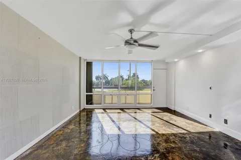 a view of a room with a large window