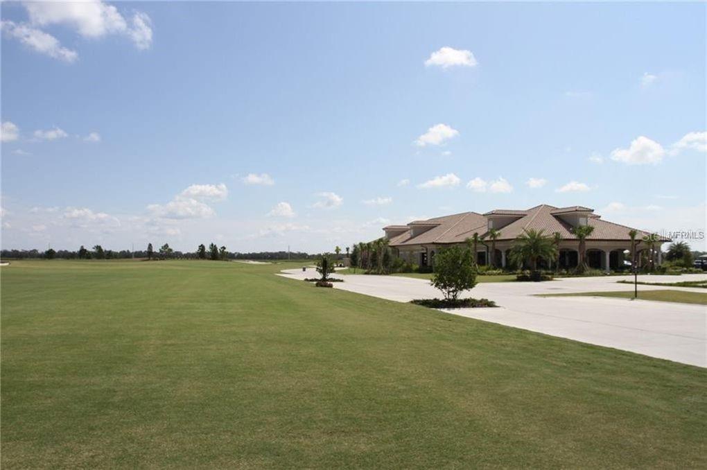 5528 Arnie Loop Lakewood Ranch, FL 34211 - Photo 38 of 59 a view of a swimming pool and lake view
