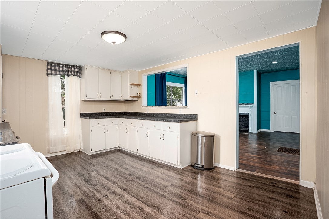 59 Church Street Notasulga, AL 36866 - Photo 27 of 38 This spacious kitchen offers ample cabinet and counter space, ideal for culinary creations and casual dining.