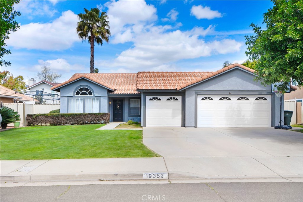 19352 Bridgewater Lane Riverside, CA 92508 - Photo 1 of 1 a front view of a house with a garden and yard