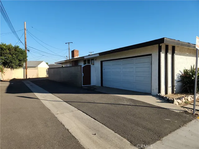 a kitchen with stainless steel appliances a sink cabinets and a refrigerator