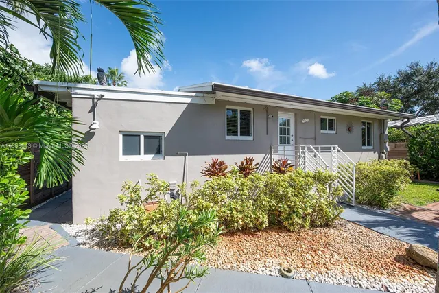 a view of patio with chairs and backyard