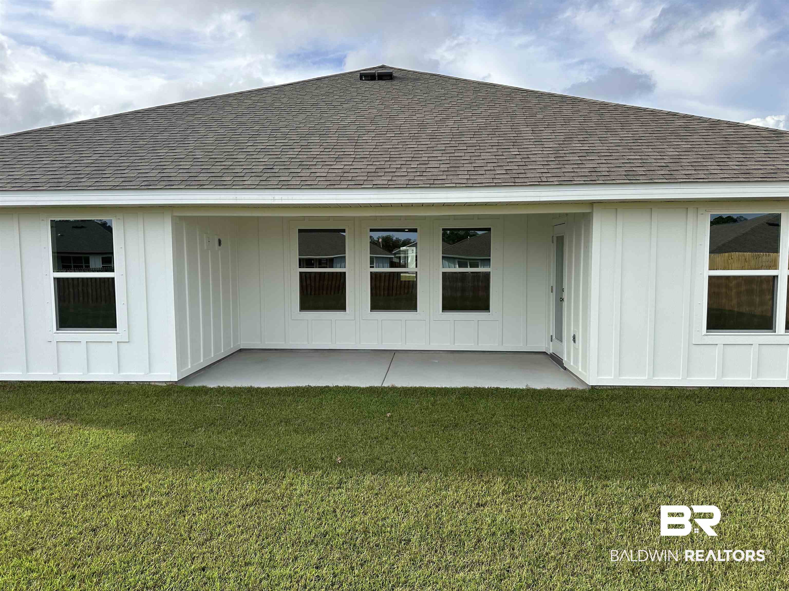 8850 Sea Star Circle Foley, AL 36535 - Photo 10 of 29 Back of house with a yard and a patio area