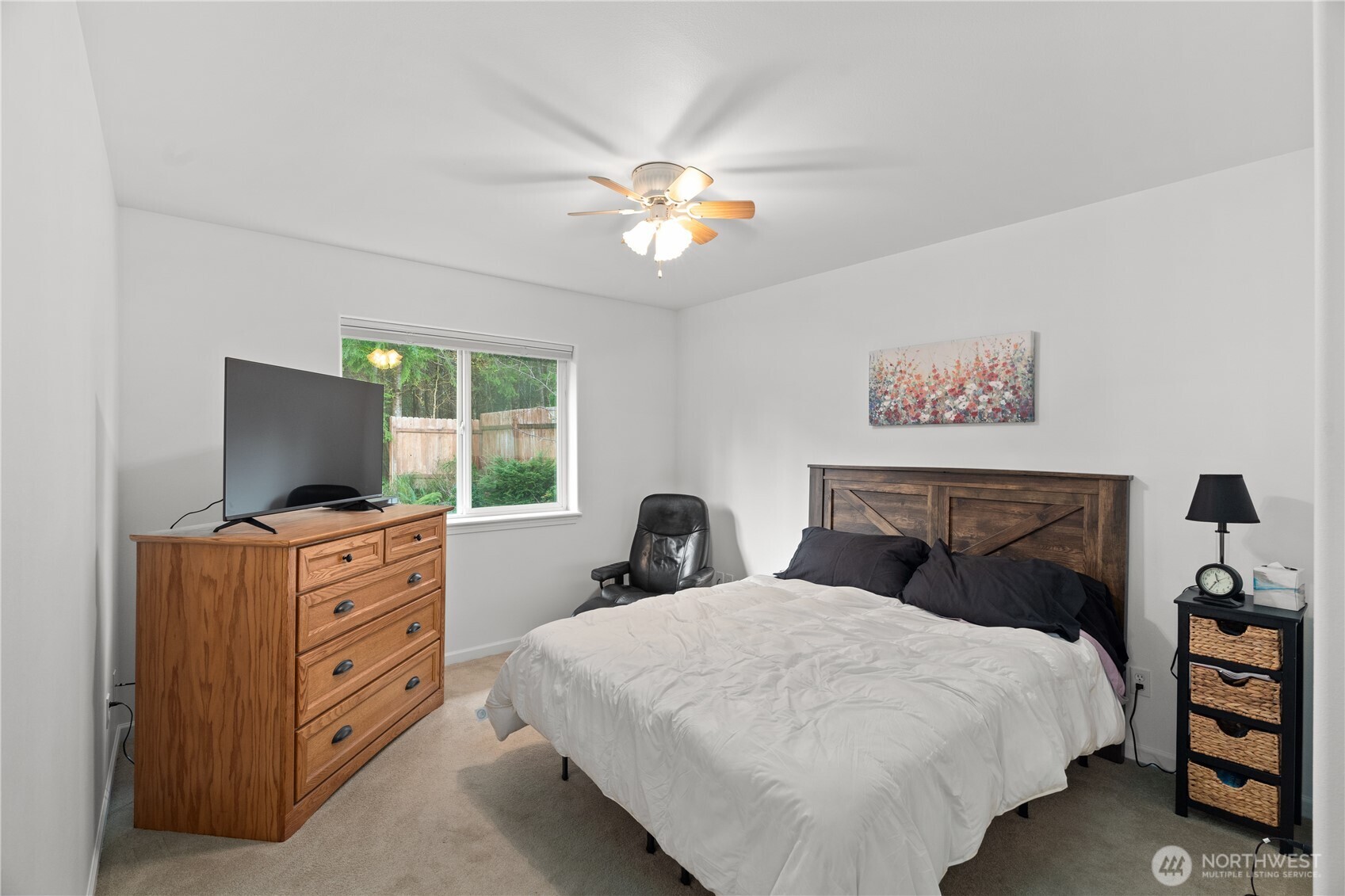 405 Andrews Avenue Cosmopolis, WA 98537 - Photo 11 of 34 a bedroom with a bed and a flat screen tv