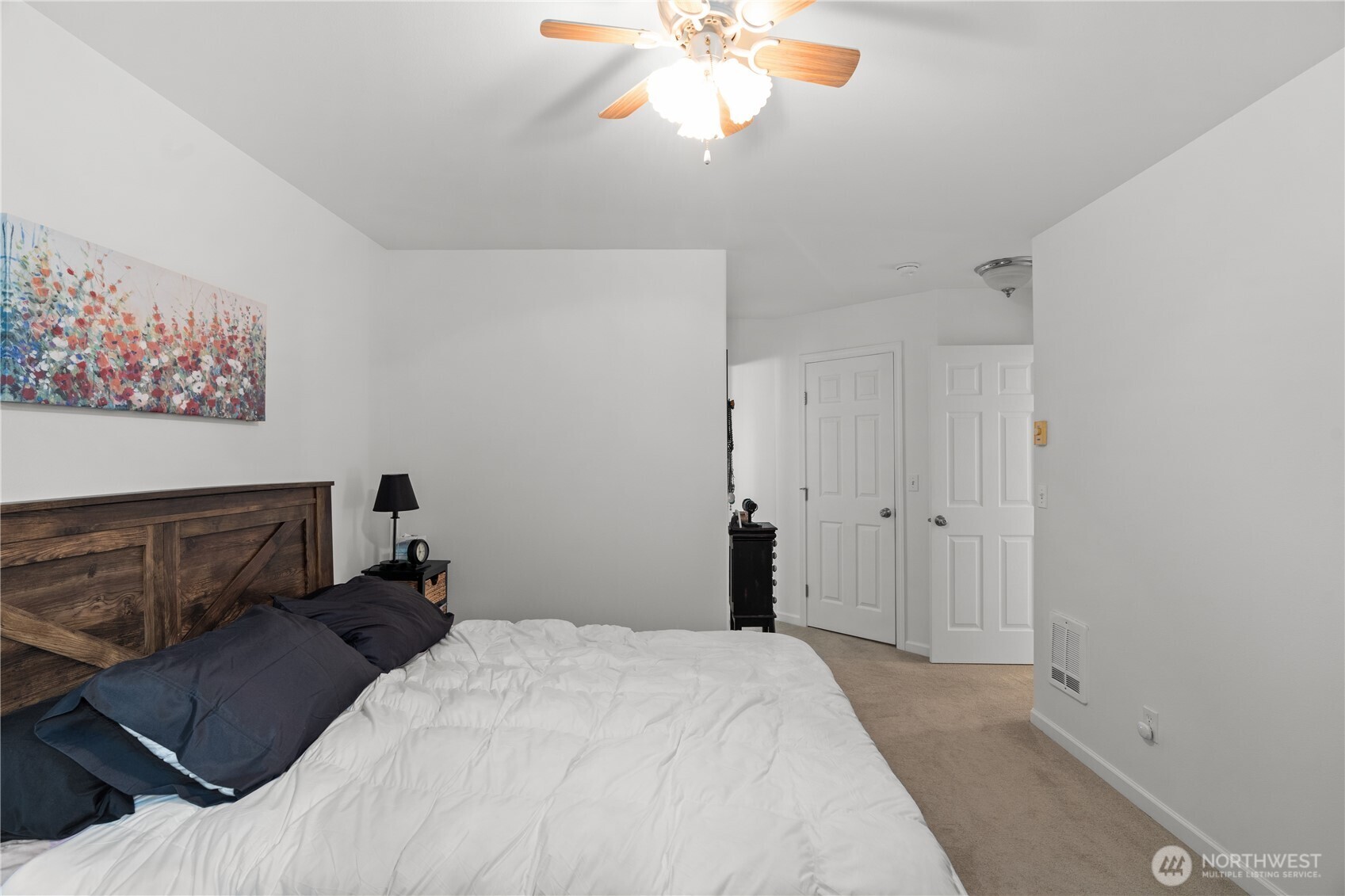 405 Andrews Avenue Cosmopolis, WA 98537 - Photo 12 of 34 a bedroom with a bed and a chandelier