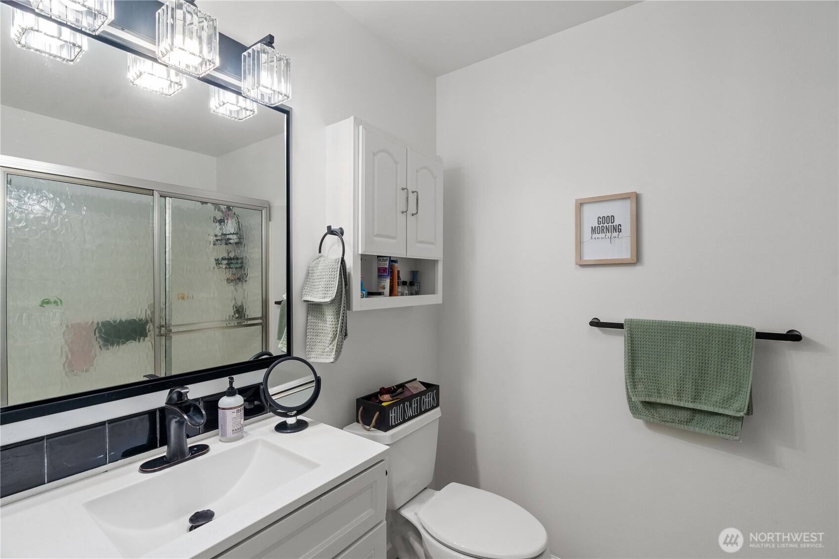 405 Andrews Avenue Cosmopolis, WA 98537 - Photo 13 of 34 a bathroom with a sink vanity mirror and toilet