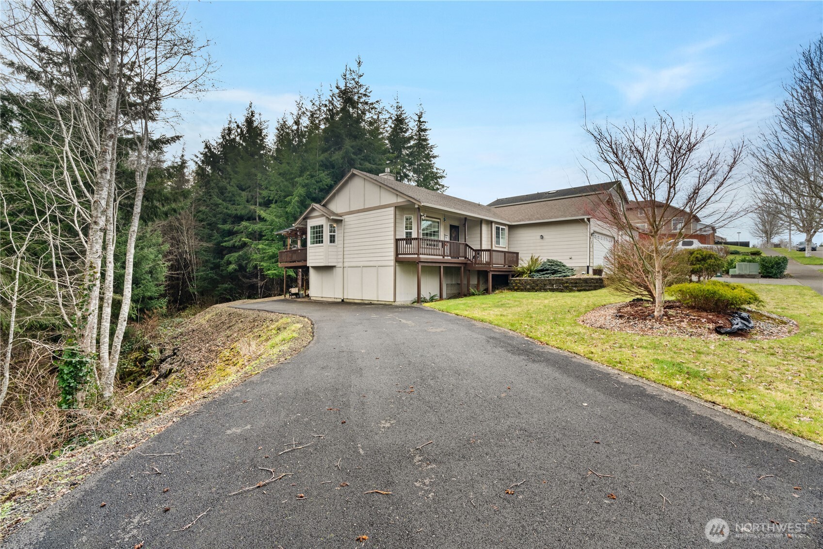 405 Andrews Avenue Cosmopolis, WA 98537 - Photo 30 of 34 a view of a house with a big yard and large trees