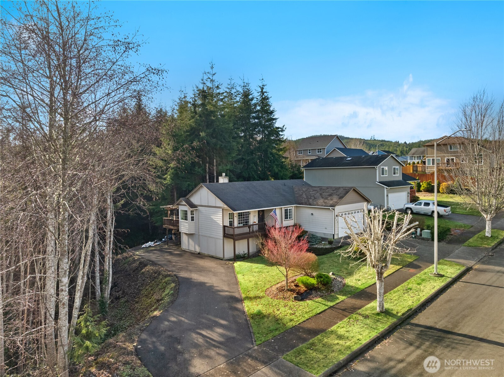 405 Andrews Avenue Cosmopolis, WA 98537 - Photo 32 of 34 a view of a white house with a big yard and large tree