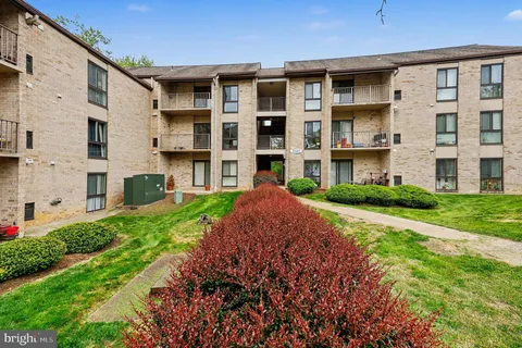 a view of a building with a yard