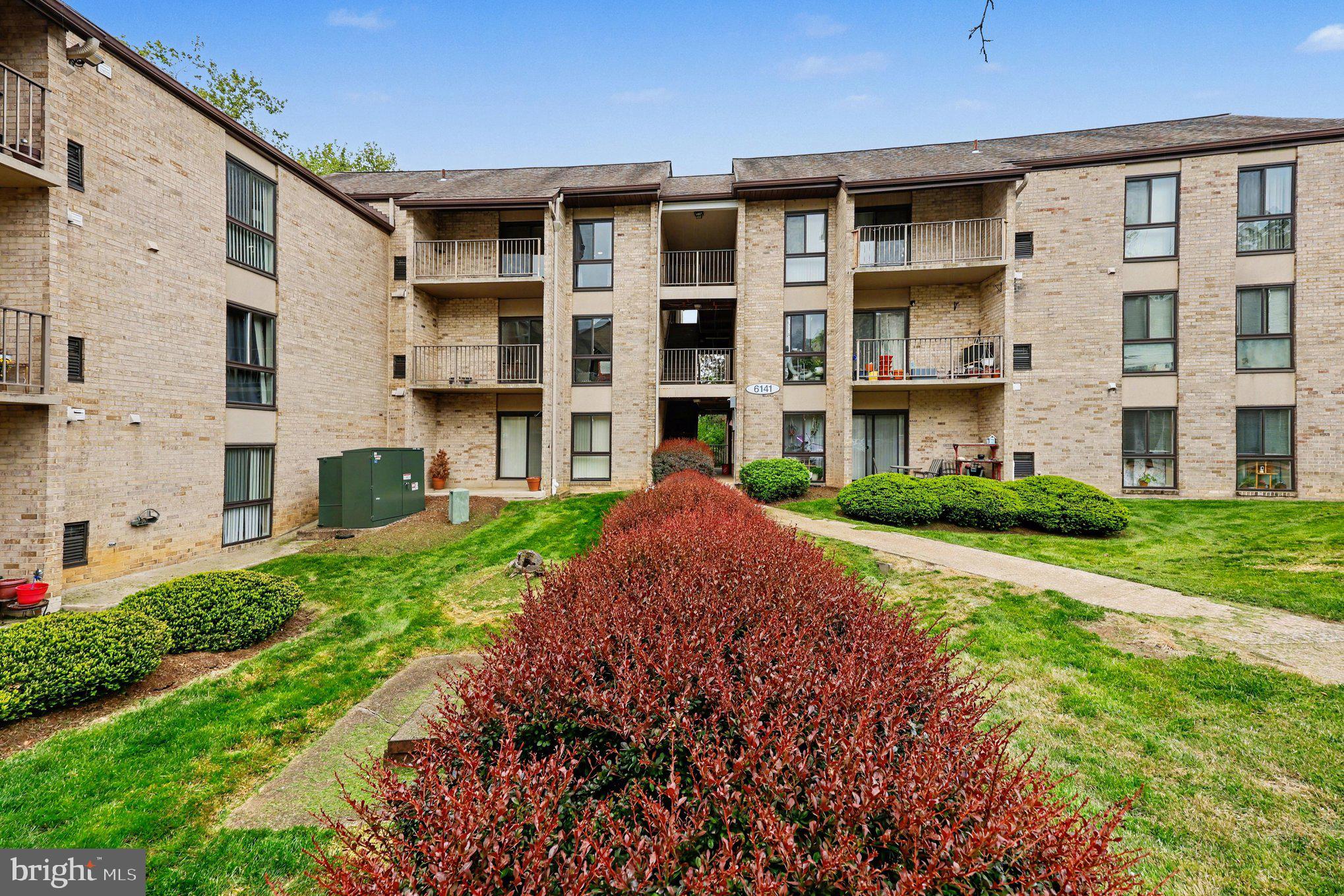 6141 Edsall Road, Unit L Alexandria, VA 22304 - Photo 17 of 18 a front view of a building with a garden