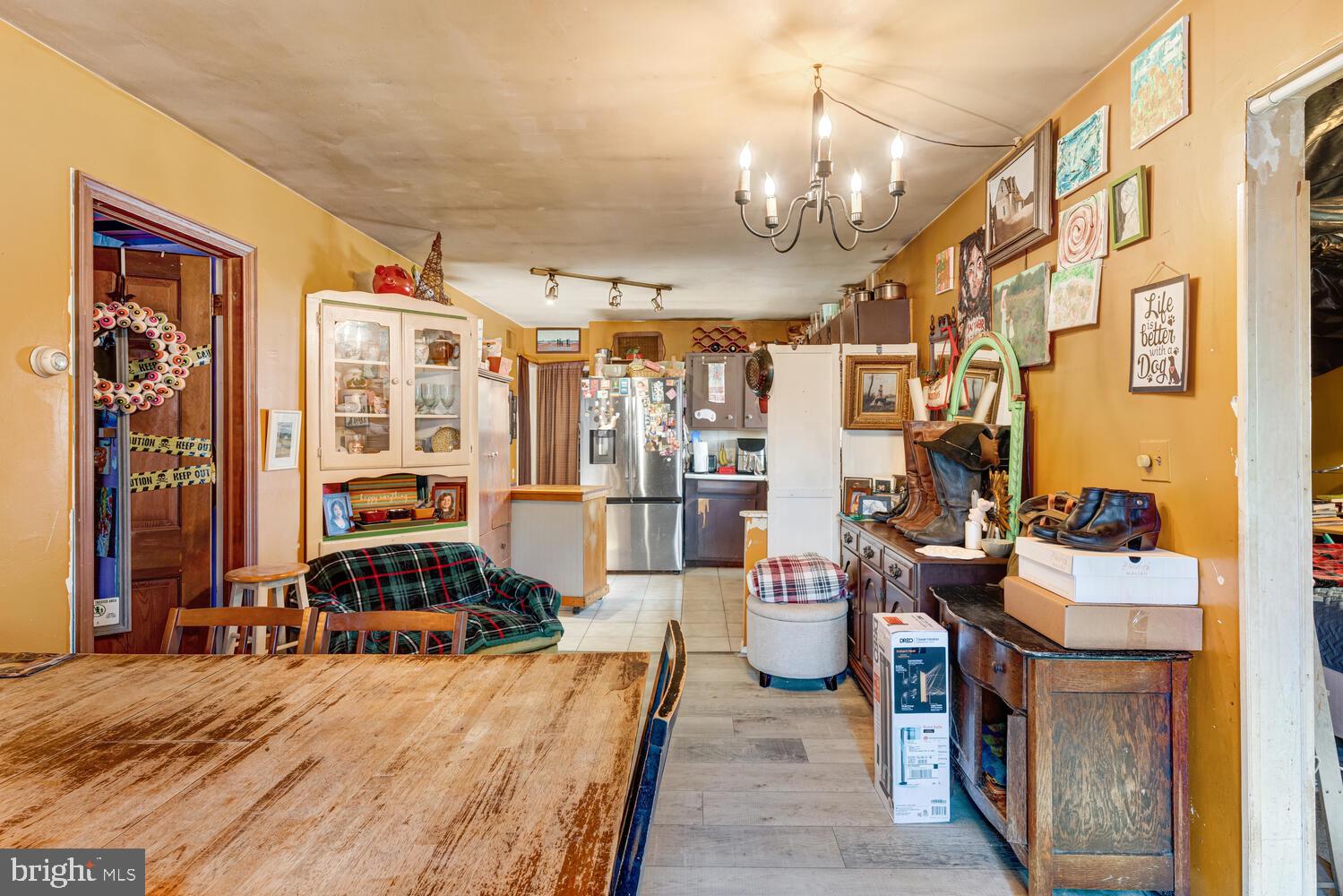 886 Radio Road Little Egg Harbor, NJ 08087 - Photo 11 of 22 a living room filled with furniture and a chandelier