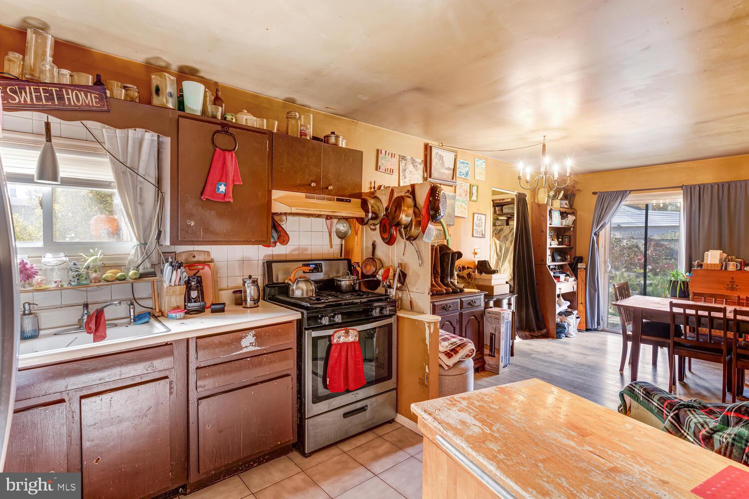 886 Radio Road Little Egg Harbor, NJ 08087 - Photo 18 of 22 a kitchen with stainless steel appliances kitchen island granite countertop a sink and cabinets